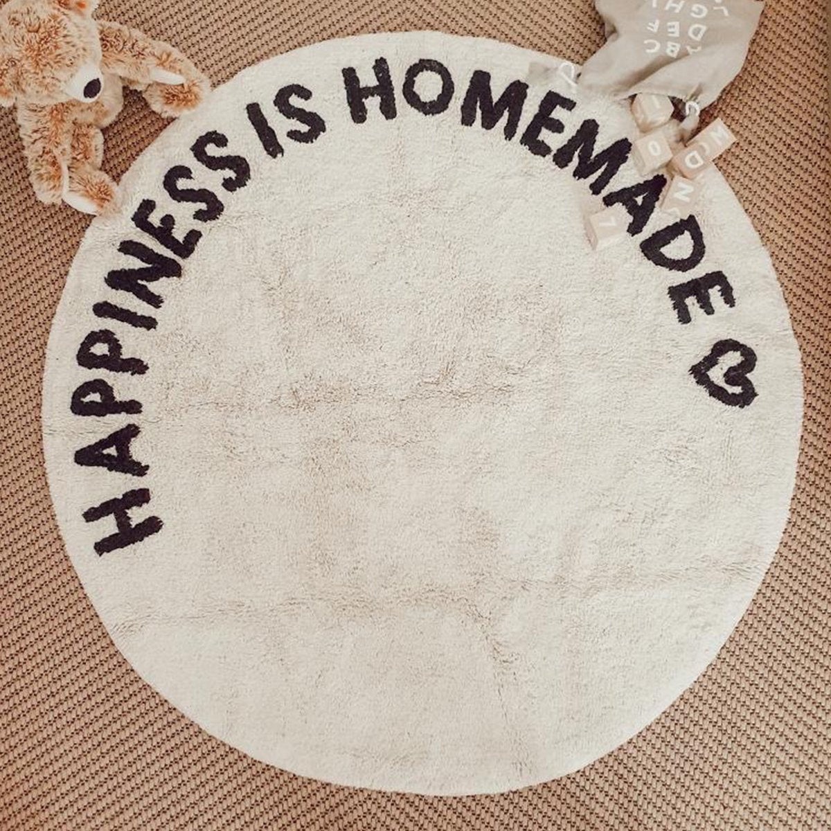 Rond geweven vloerkleed Happiness is homemade